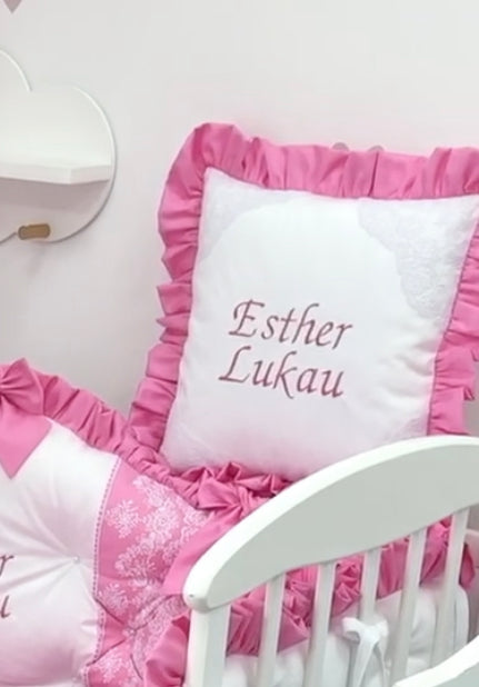Decorative pillow with ruffle and embroidery with a bow. Personalized gift.